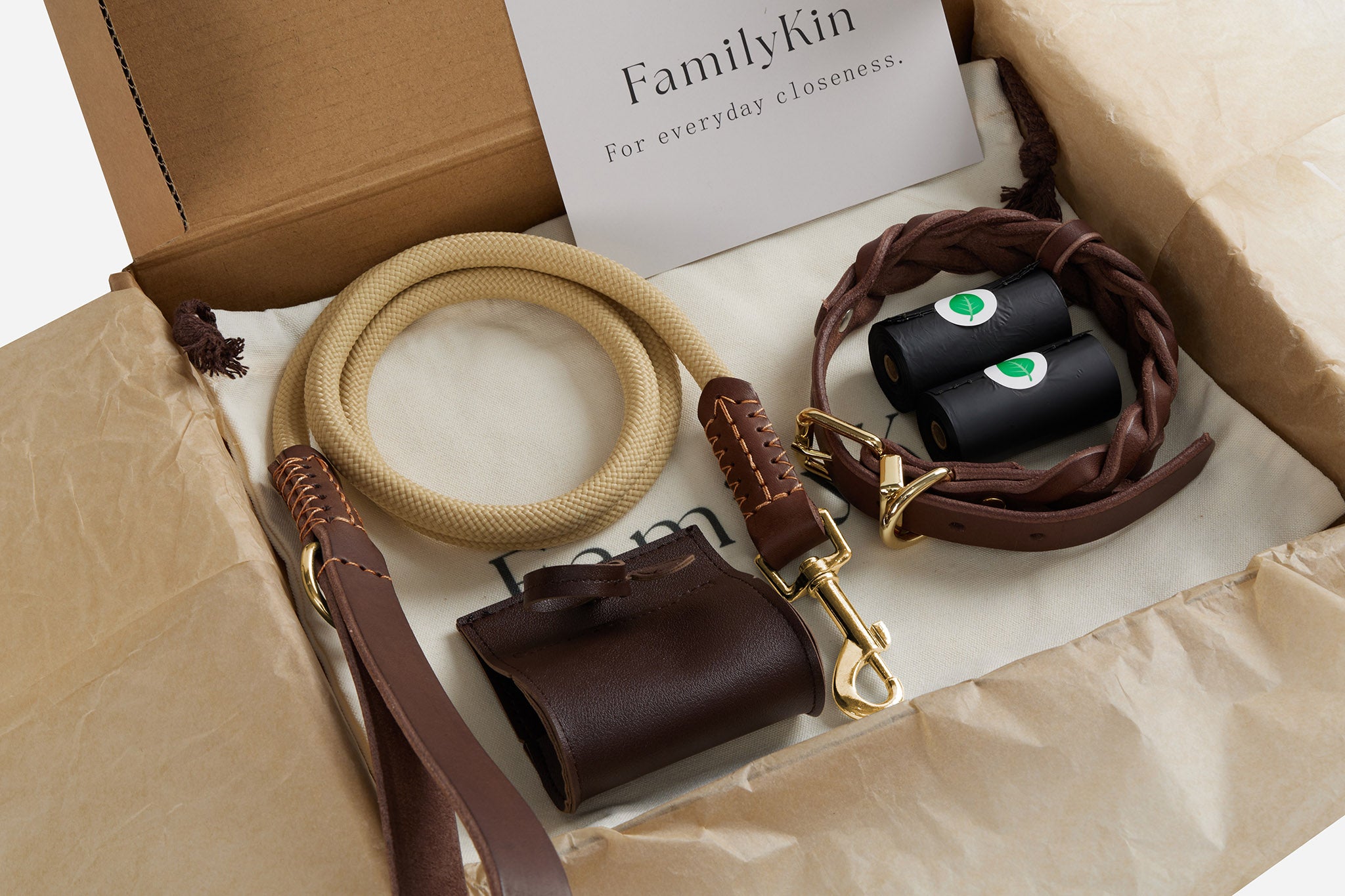 Everyday Walk Set arranged with branded packaging, braided collar, leash, dispenser, and refill rolls.