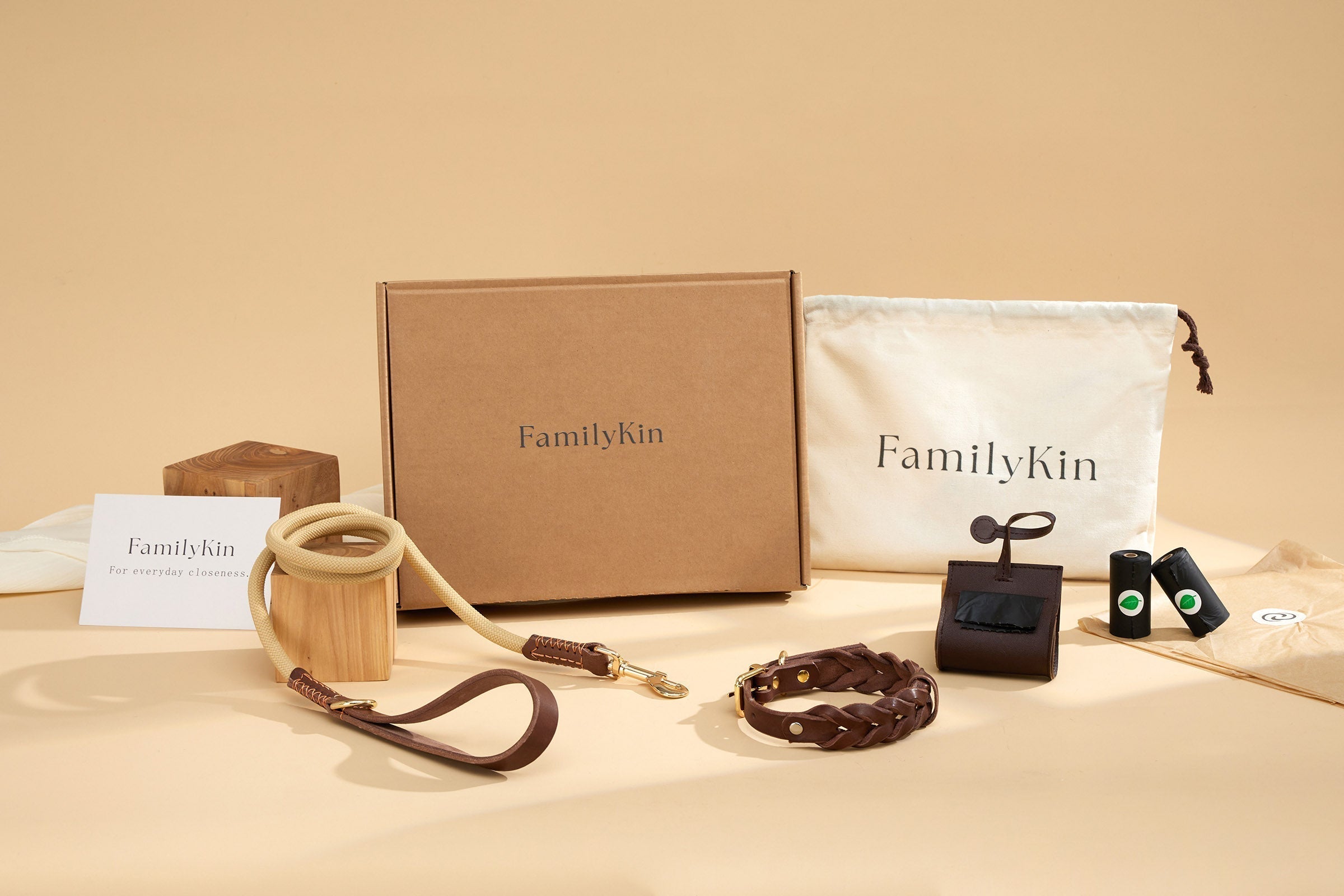 Basic dog walking setup with collar, leash, waste bag dispenser, refill rolls, and leather dog ID tag
